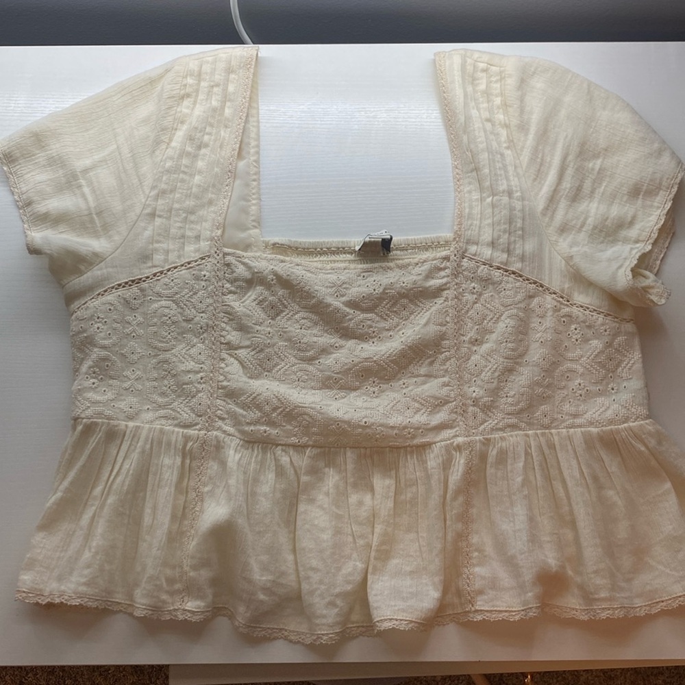 Cream colored American Eagle ruffled shirt. Size large.